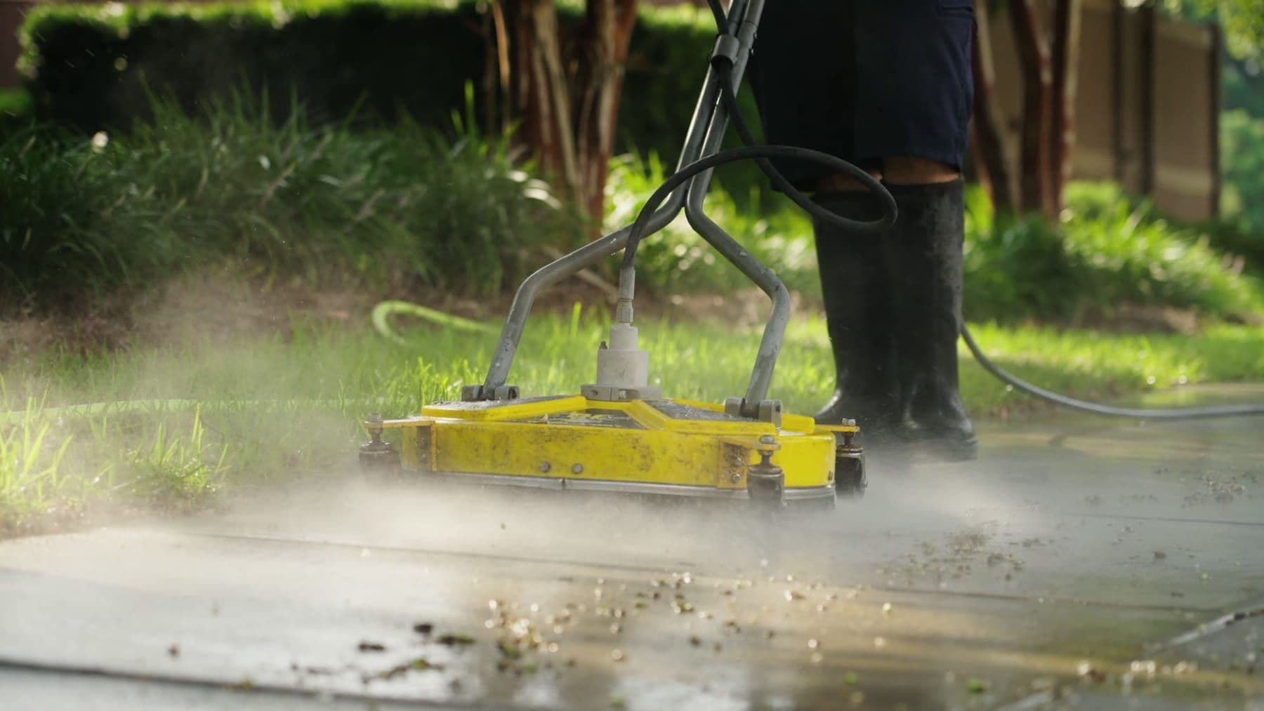 A surface cleaner cutting a clean pass across commercial concrete flatwork in Charleston, SC