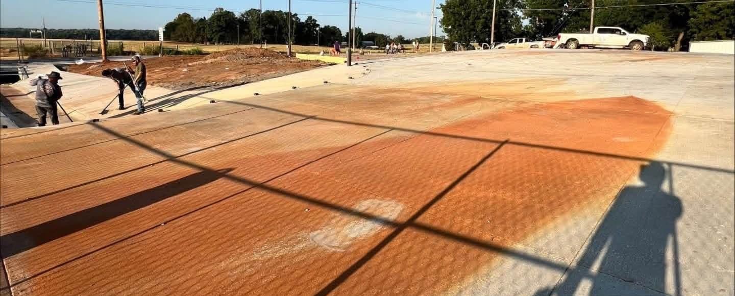 Orange rust staining on commercial wall panels, partly cleaned, in Charleston, SC
